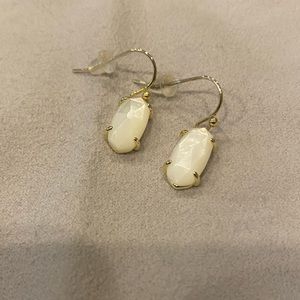 Kendra Scott gold drop earrings with white stone